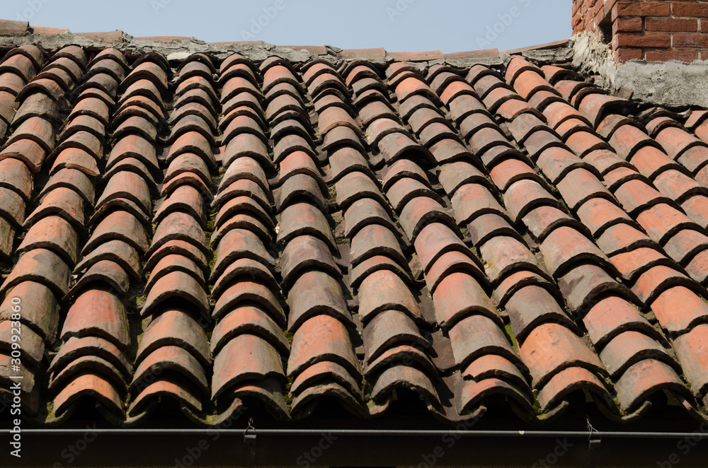 Roof of an ancient house with ancient and old tiles. Roof of an ancient house with ancient and old tiles.