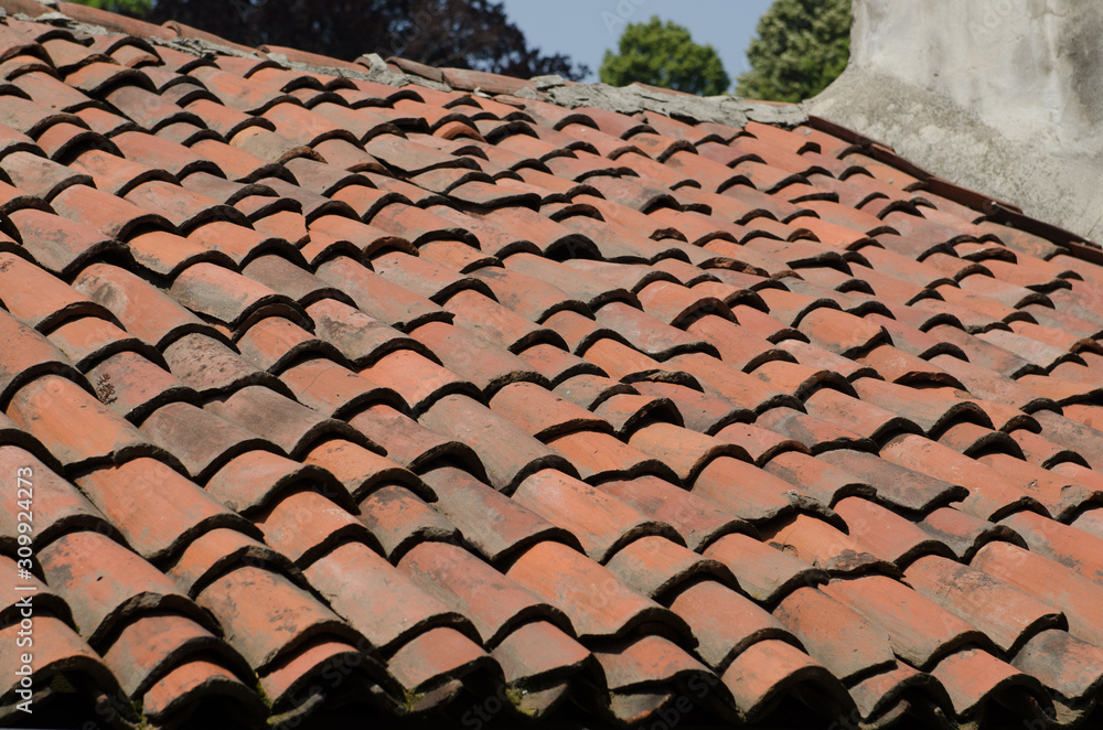 Naklejka premium Roof of an ancient house with ancient and old tiles.