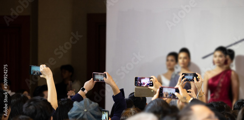 Fotografie Fashion dress Model walk back on dark Runway Fashion Show catwalk along way fina