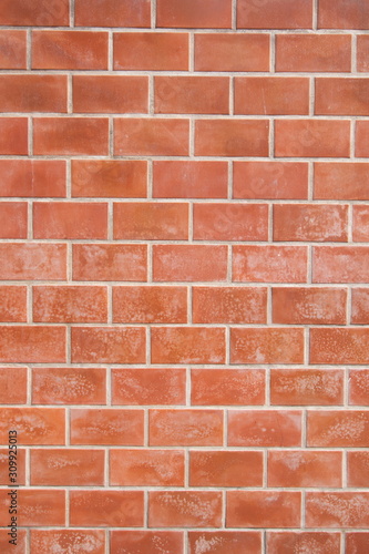 orange brick block wall . vertical picture .