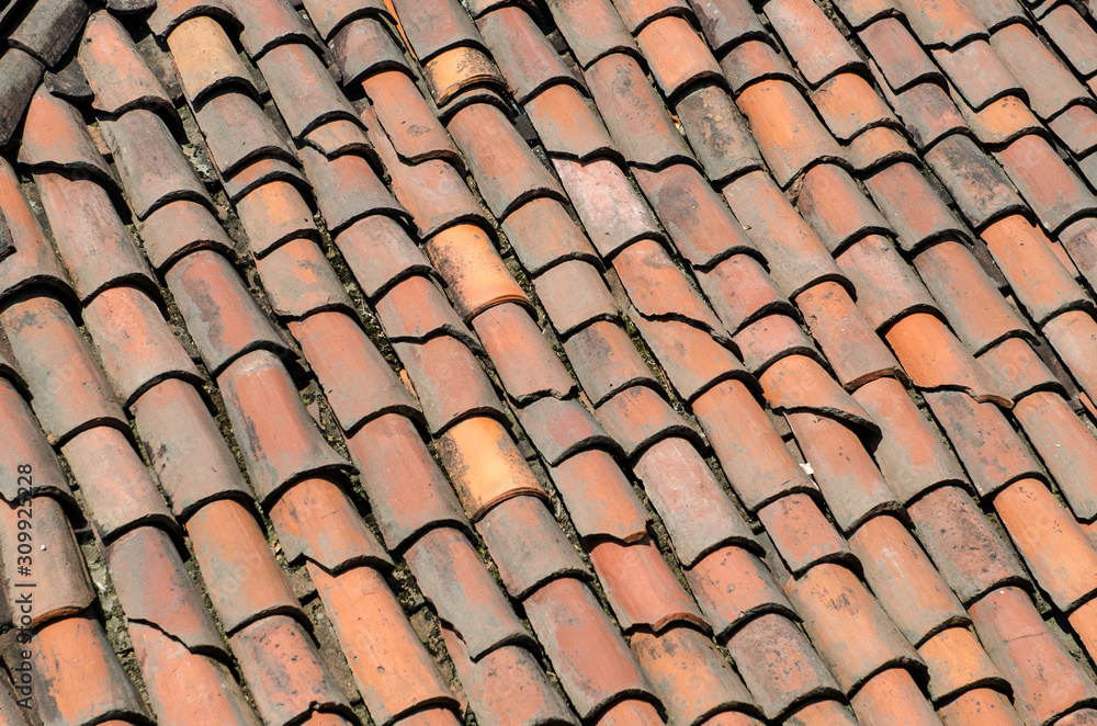 Roof of an ancient house with ancient and old tiles. Roof of an ancient house with ancient and old tiles.