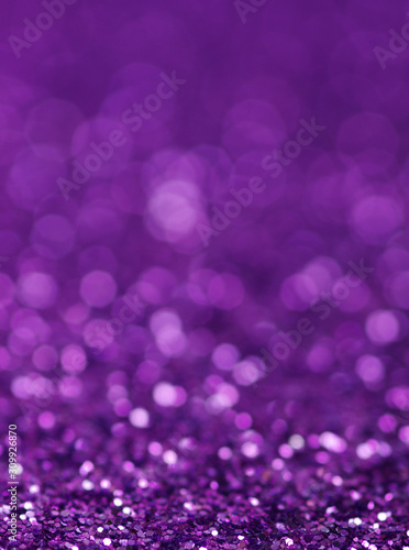 Purple glitter lights background. defocused
