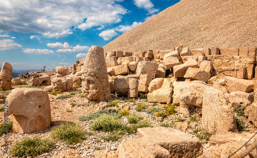 Panoramic view of some of the statues near the peak of Nemrut Dagi. King Antiochus I Theos of Commagene built on the mountain top of Mount Nemrut a tomb-sanctuary flanked by huge statues. Turkey