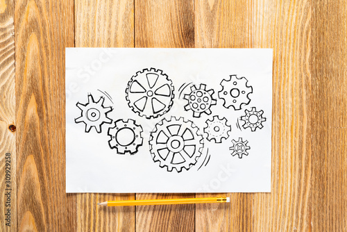 Group of rotating gears pencil hand drawn