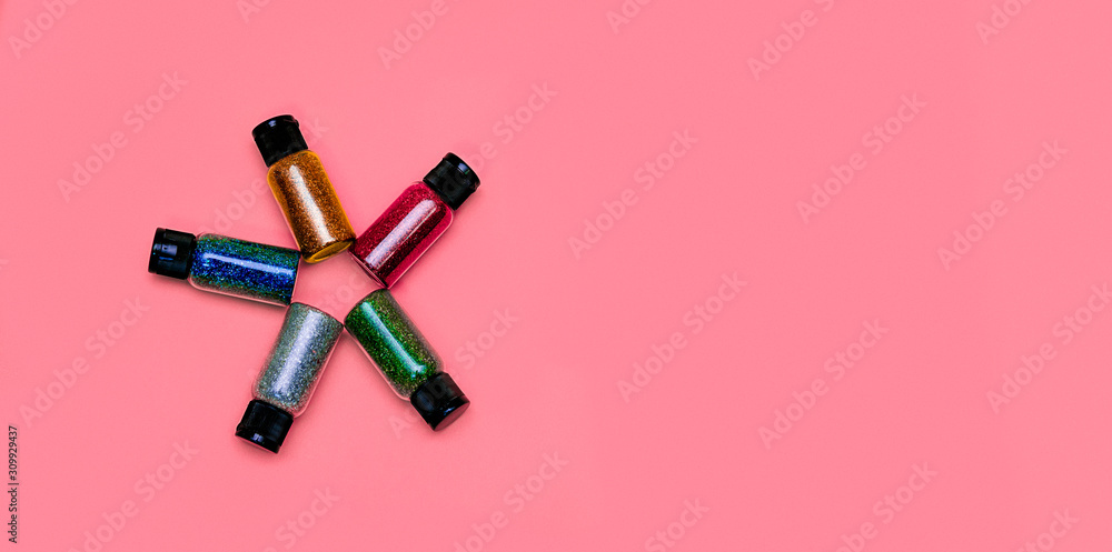 Colorful glitters, sun shape, on a flat lay photo, can fit for banners or craft instagram, with a pink background Colorful glitters, sun shape, on a flat lay photo, can fit for banners or craft instagram, with a pink background