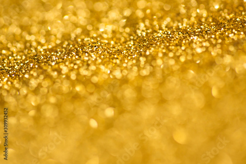 Gold glitter bokeh lights .Defocused illumination for holidays backgrounds