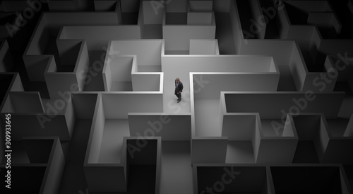 Business man lost in the center of a maze