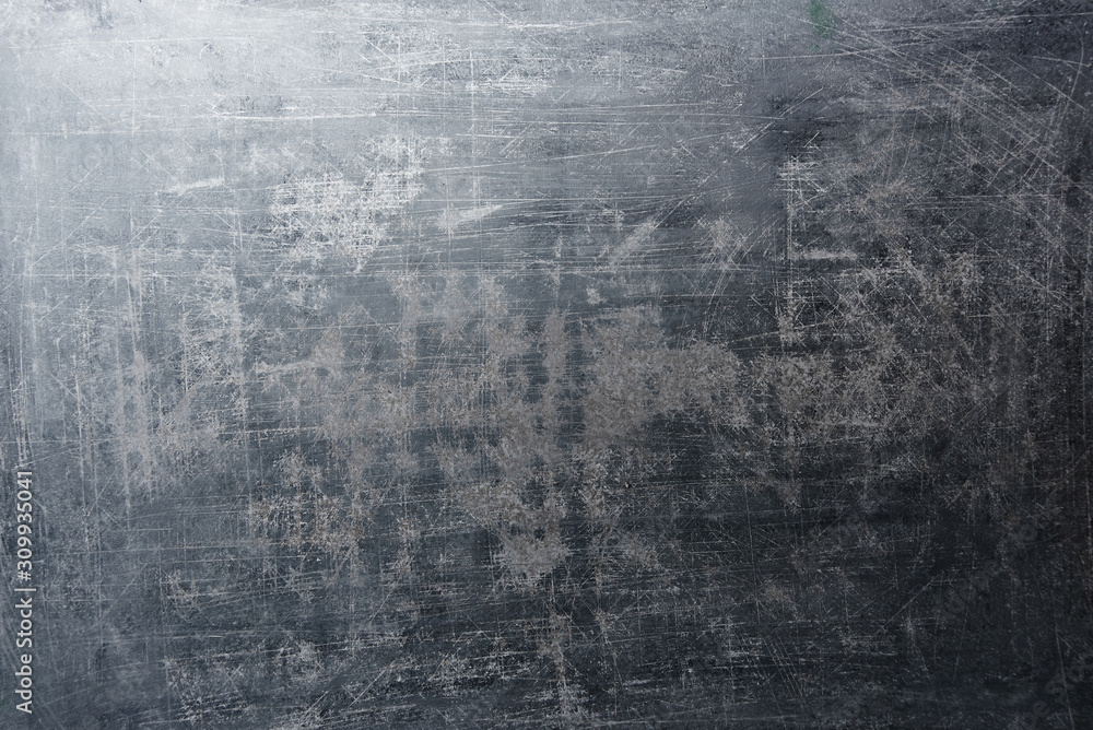 Shabby abstract gray metallic background. Aged grunge texture with scratches and damage