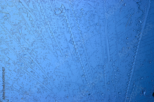 blue ice glass background  abstract texture of the surface of the ice on the glass  frozen seasonal water