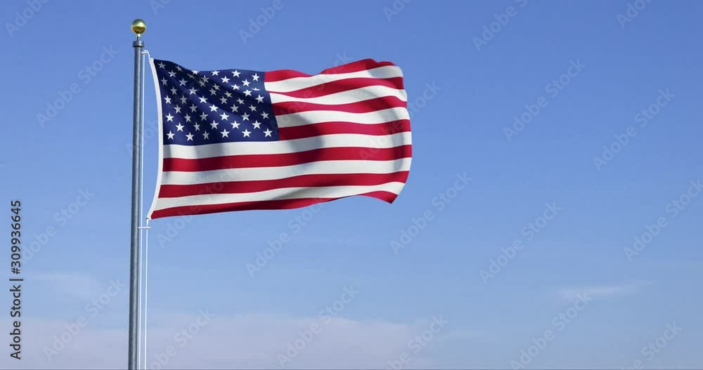 american flag of united states of america blowing in wind with blue sky american flag of united states of america blowing in wind with blue sky