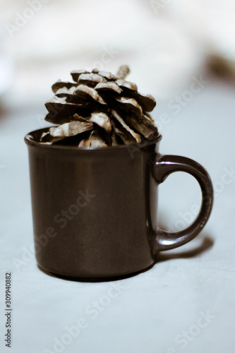 A small black glass with an oak of an oak tree