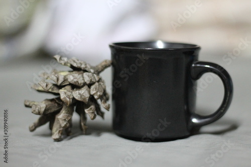 A small black glass with an oak of an oak tree