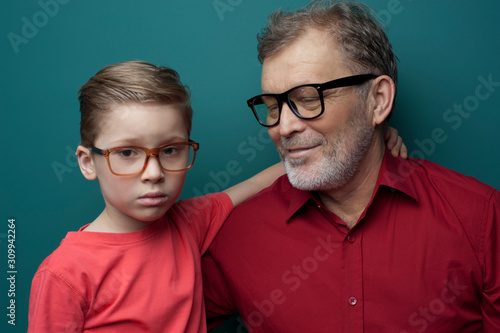 Close-up grandfather and grandson in glasses