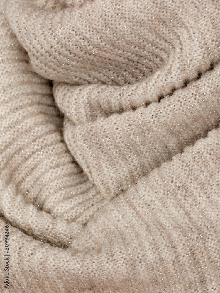 Knitted fabric natural beige wool cozy texture