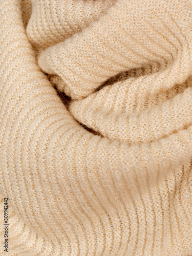 Knitted fabric natural beige wool cozy texture