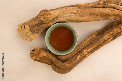 Ayahuasca drink and wood. photo