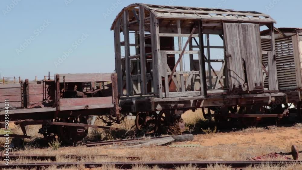 old train vagons made of wood in the middle of the desert old train vagons made of wood in the middle of the desert