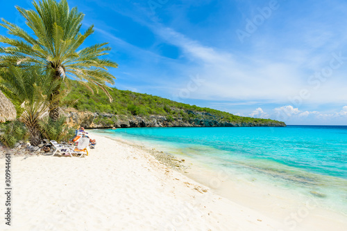 Cas Abao beach - paradise white sand Beach with blue sky and crystal clear blue water in Curacao, Netherlands Antilles, a Caribbean tropical Island
