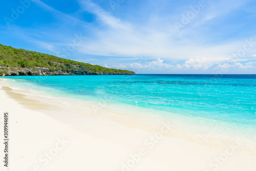 Fototapeta Naklejka Na Ścianę i Meble -  Cas Abao beach - paradise white sand Beach with blue sky and crystal clear blue water in Curacao, Netherlands Antilles, a Caribbean tropical Island