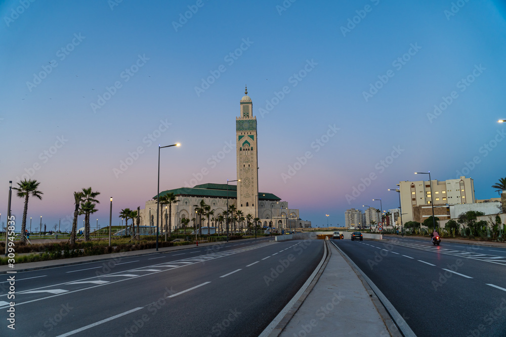 view of Hassan II Mosque seen from road at sunset - Casablanca, Morocco