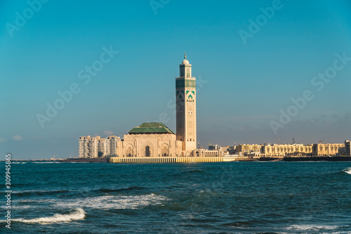 scenic view of Hassan II Mosque against blue sky - The Hassan II Mosque or Grande Mosquée Hassan II is a mosque in Casablanca, Morocco.