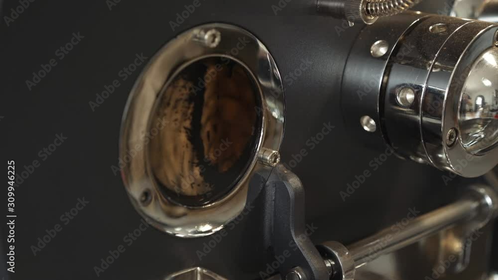 Coffee roasted beans are spinning in machine. 4K. Coffee roasted beans are spinning in machine. 4K.