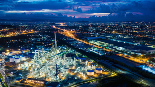refinery zone at night and lighting cityscape with blue sky background