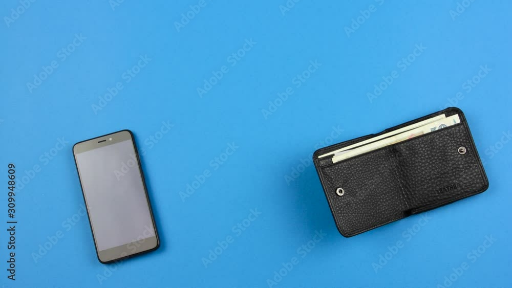 cash currency flies from black leather wallet to smartphone and back, concept of wireless finance transaction for e commerce or modern banking technology, blue background, loop stopmotion animation cash currency flies from black leather wallet to smartphone and back, concept of wireless finance transaction for e commerce or modern banking technology, blue background, loop stopmotion animation