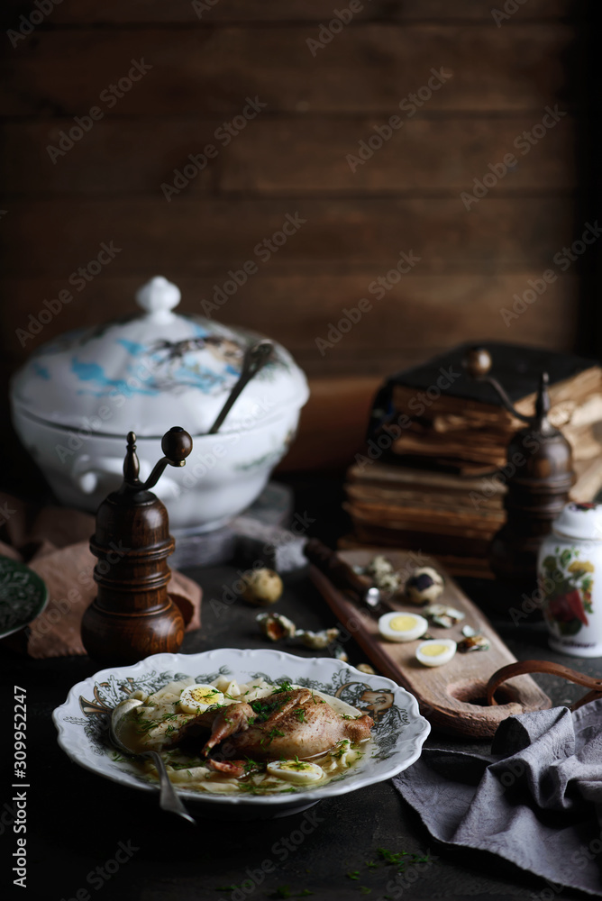 Fototapeta premium quail soup with homemade noodles.style rustic