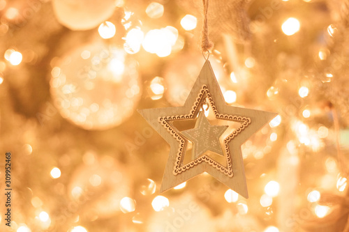 Christmas tree decoration close up, golden sparkling bokeh background