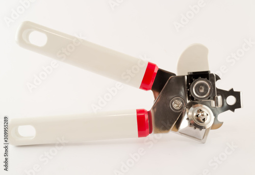 Multifunctional can opener against white background photo