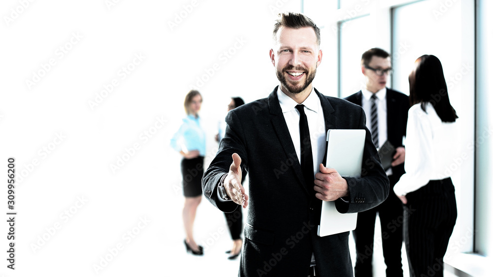 smiling businessman giving his hand for a handshake smiling businessman giving his hand for a handshake