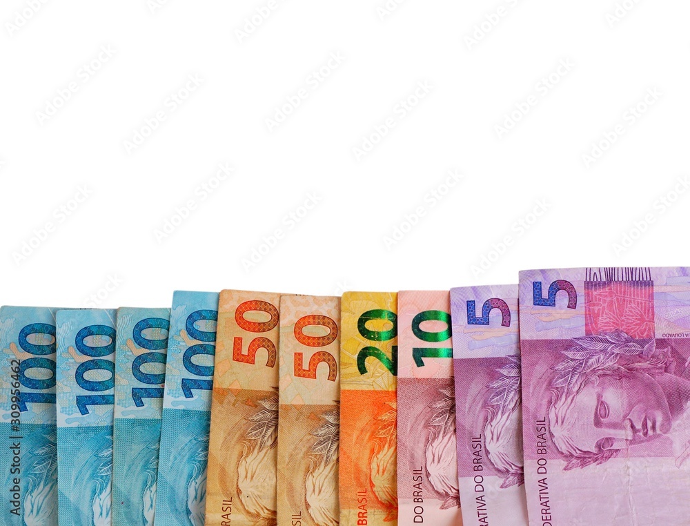 Brazilian money on white background. Real banknotes. Brazilian money on white background. Real banknotes.
