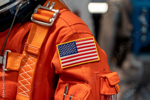 Fototapeta Naklejka Na Ścianę i Meble -  Close up of a USA flag on a space suit