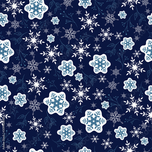 Seamless pattern with snowflakes on a blue background. Vector graphics.