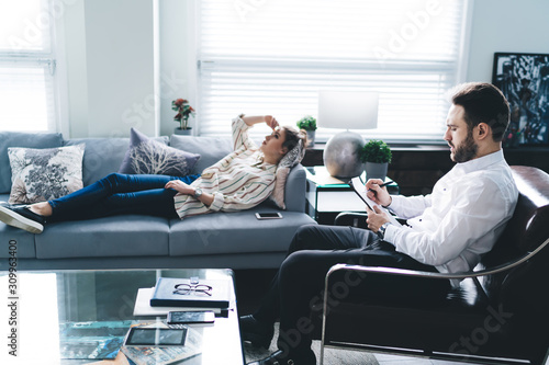 Woman and psychoanalytic in therapy session photo