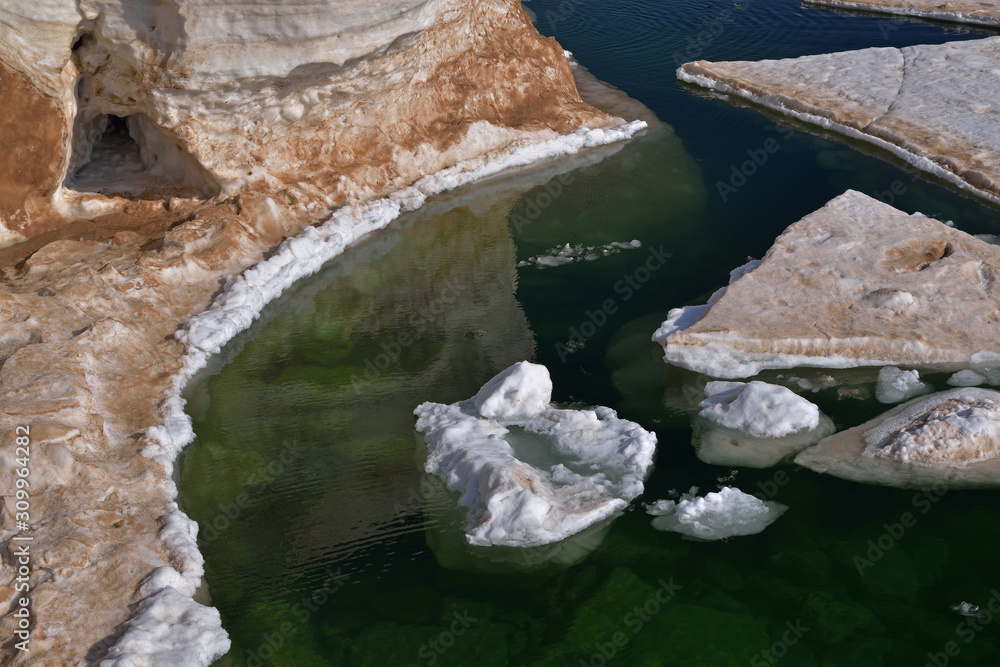 Winter landscape of frozen shoreline and icebergs, Lake Michigan, Frankfort, Michigan, USA