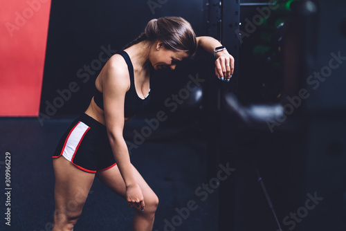 Cheerful female resting during workout