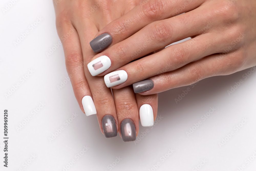 White-gray manicure with squares. New Year's gray manicure. Square nails. Nails closeup. White-gray manicure with squares. New Year's gray manicure. Square nails. Nails closeup.