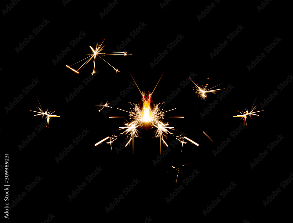 Burning sparkler isolated on black background Burning sparkler isolated on black background
