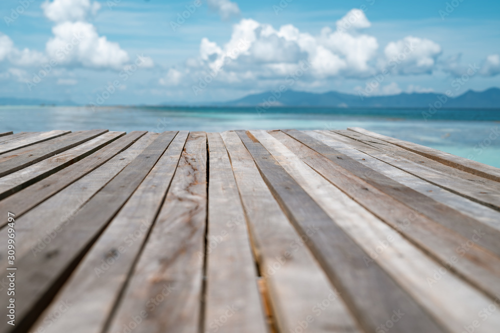 Wooden pier by the beach in tropical country. Wooden pier by the beach in tropical country.