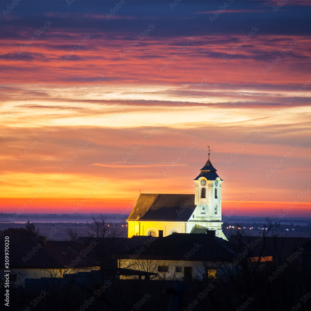 Dramatic sky in the morning at church of oggau in burgenland