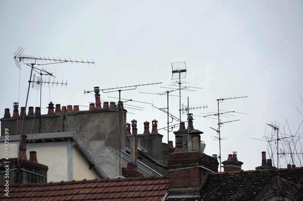 Roofs with many tv antennas. Roof with many chimneys. Smoking chimney. Many tv aerials. Awful city landscape. Roofs with many tv antennas. Roof with many chimneys. Smoking chimney. Many tv aerials. Awful city landscape.
