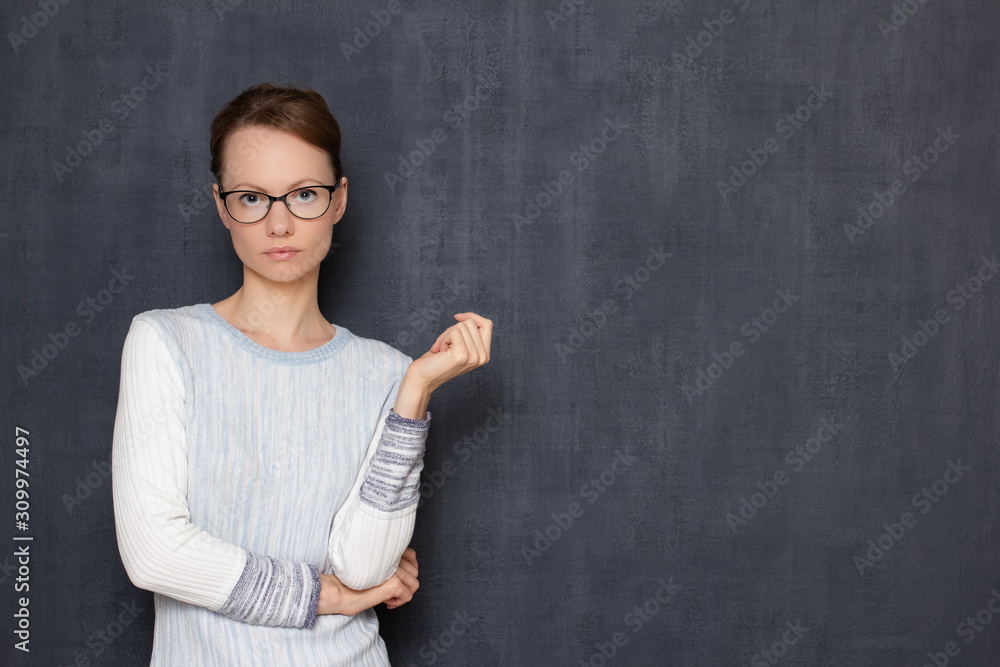 Portrait of thoughtful young woman with glasses, waiting the results