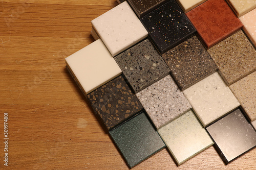 Wallpaper Mural Top view of color samples stone  on oak wood table, Acrylic Solid Surface Torontodigital.ca