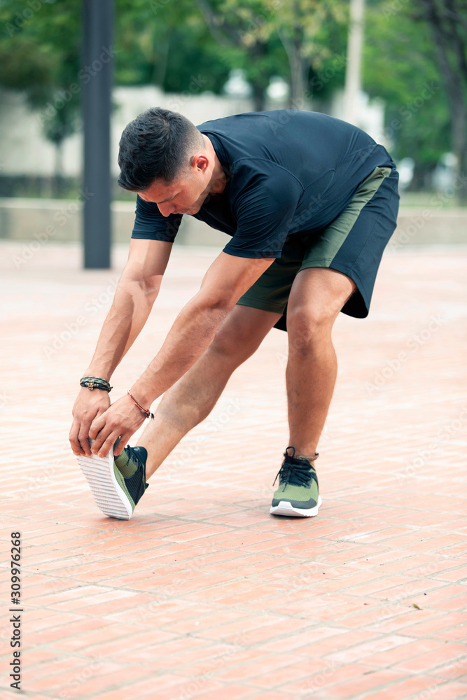 Young man exercising outdoors.