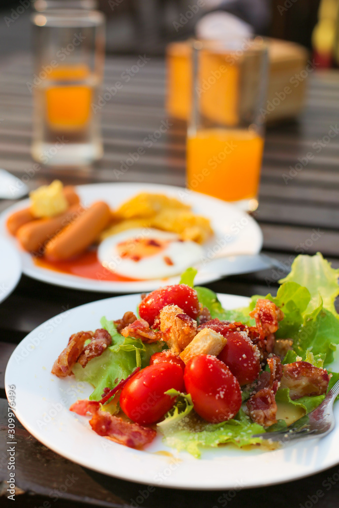 Breakfast for new day and healty food fresh vegetable include orange juice and american breakfast set on the table wood