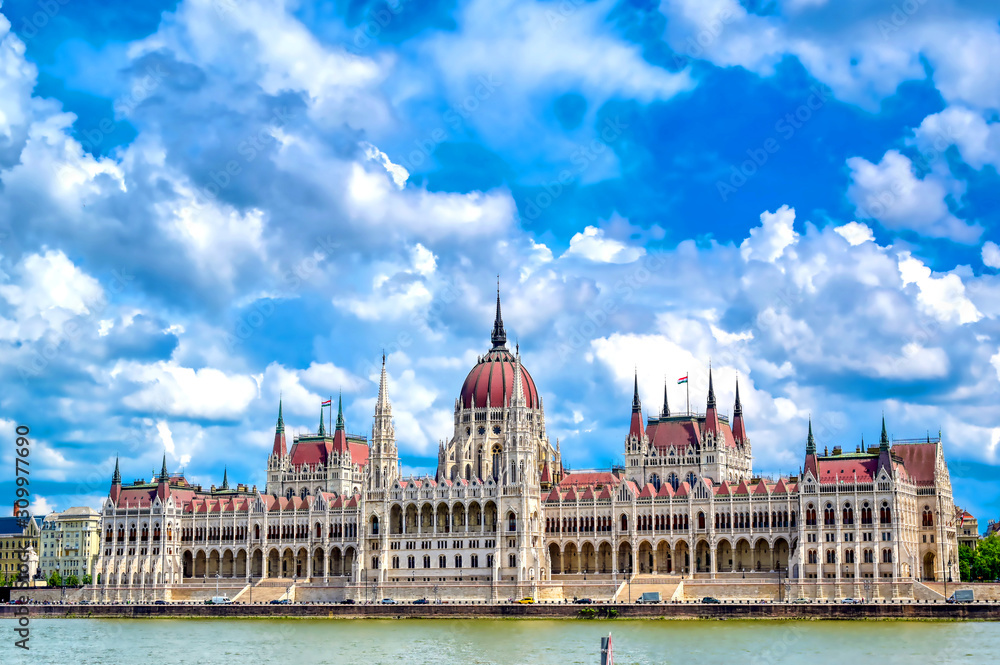Obraz premium The Hungarian Parliament Building located on the Danube River in Budapest Hungary at sunset.