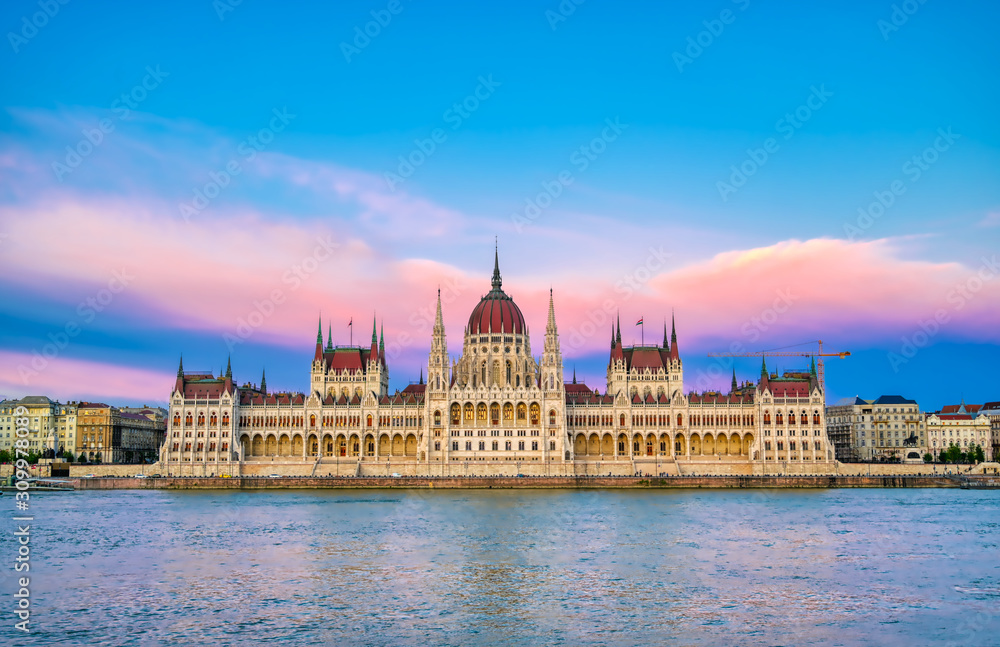 Fototapeta premium The Hungarian Parliament Building located on the Danube River in Budapest Hungary at sunset.