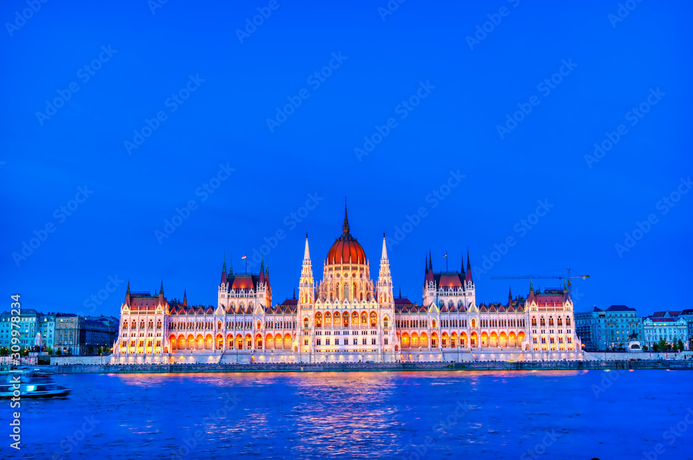Fototapeta premium The Hungarian Parliament Building located on the Danube River in Budapest Hungary at sunset.